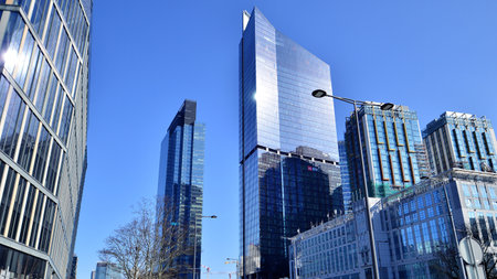 Glass curtain wall of modern office building. Modern office building on a clear sky background.