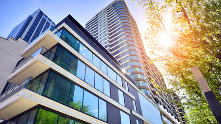 Eco architecture. Green tree and new residential building. Harmony of nature and modernity. Modern...