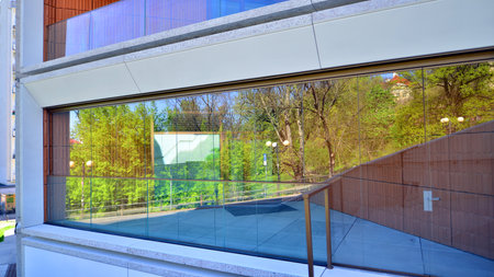 Eco architecture. Green tree and new residential building. Harmony of nature and modernity. Modern...