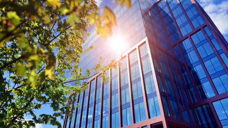 Eco building in modern city concept. Modern office building with the fresh green leaves.