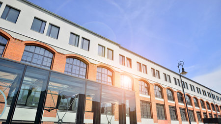 Sustainable glass office building with trees for reducing carbon dioxide. Eco-friendly building in...