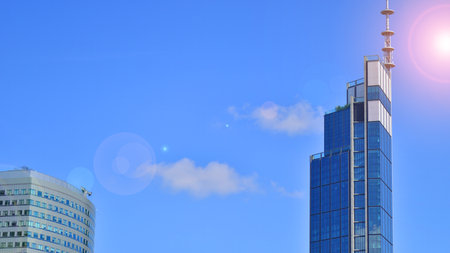 European modern office architecture. View of modern skyscrapers in business district against blue sky. Looking up at business buildings in downtown.の写真素材