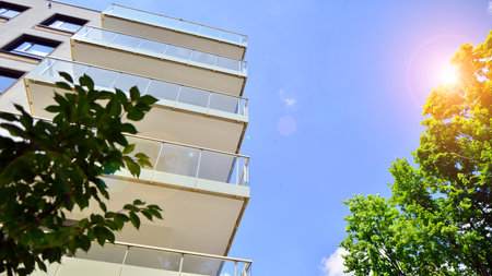 European residential architecture harmonizing with nature. Eco-friendly living in city with greens....