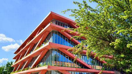 Eco architecture. Green tree and glass office building. The harmony of nature and modernity....
