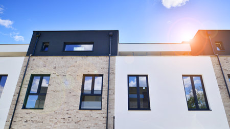 Terraced single family homes in newly developed housing estate. The real estate market in the suburbs.の写真素材