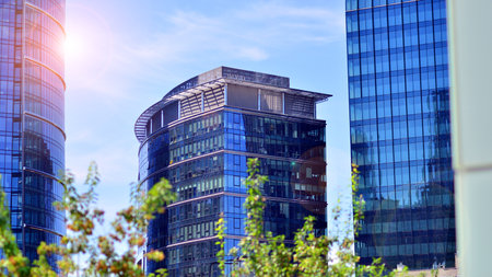City life, urban landscape and ecology. Modern office complex with glass facades and smooth lines...