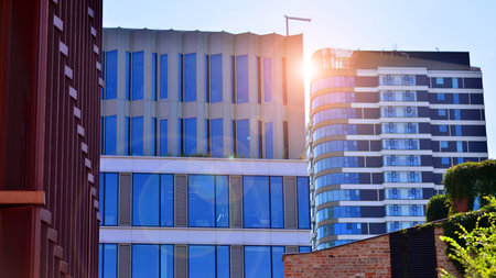 Modern sustainable glass office buildings. Exterior view of corporate headquarters glass buildings architecture.Glass windows in energy-efficient buildings. Financial business centerの写真素材