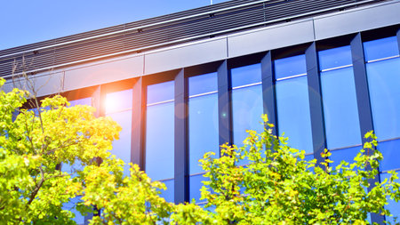 City life, urban landscape and ecology. Modern office complex with glass facades and smooth lines...