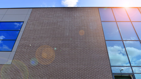 Fragment of a modern building made of steel and glass. Abstract modern commercial architecture...