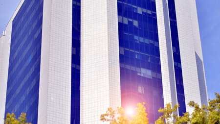 City life, urban landscape and ecology. Modern office complex with glass facades and smooth lines...