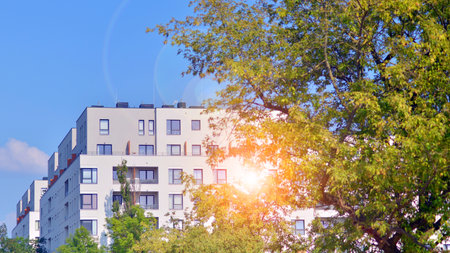Eco apartment building saving energy and fresh air concept. European residential architecture harmonizing with nature. Eco-friendly living in city with greens.の写真素材