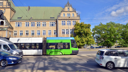 Szczecin, Poland. 14 September 2024. Urban transportation infrastructure and urban landscape. Tram on the street. City traffic.のeditorial素材