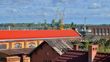Szczecin, Poland. 14 September 2024. Odra river and industrials buildings of harbor. Port of...