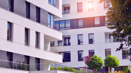 Eco apartment building saving energy and fresh air concept. European residential architecture harmonizing with nature. Eco-friendly living in city with greens.の写真素材