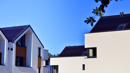 Residential homes with modern facade.Terraced family homes in newly developed housing estate. The real estate market in the suburbs. New single family houses in a new development aの写真素材