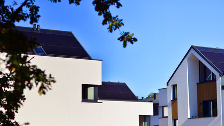 Residential homes with modern facade.Terraced family homes in newly developed housing estate. The real estate market in the suburbs. New single family houses in a new development aの写真素材