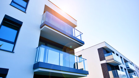 Modern multifamily building in a European city. Walls made of concrete. Luxury house complex.の写真素材