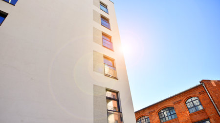 Modern multifamily building in a European city. Walls made of concrete. Luxury house complex.の写真素材