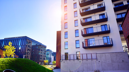 Modern multifamily building in a European city. Walls made of concrete. Luxury house complex.