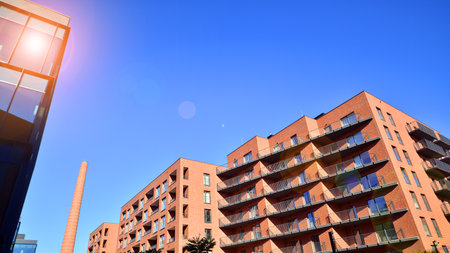 Modern multifamily building in a European city. Walls made of concrete. Luxury house complex.の写真素材