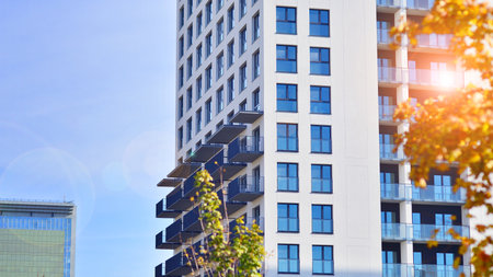 Modern residential building with new apartments in a green residential area. Eco architecture....