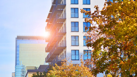 Modern residential building with new apartments in a green residential area. Eco architecture....