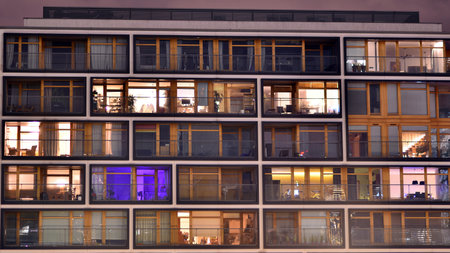The facade of a residential building in the night. Modern architecture. Night City.の写真素材