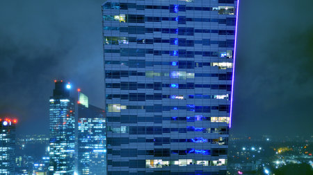 Aerial photography of modern architectural landscapes at night. Lights in the windows of buildings. The blue color of twilight.の写真素材