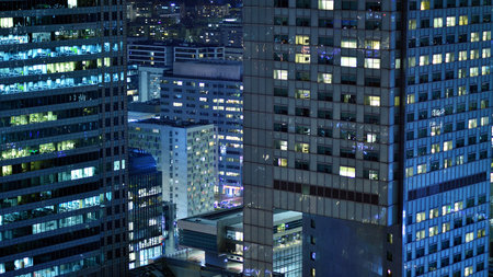 Aerial photography of modern architectural landscapes at night. Lights in the windows of buildings. The blue color of twilight.の写真素材