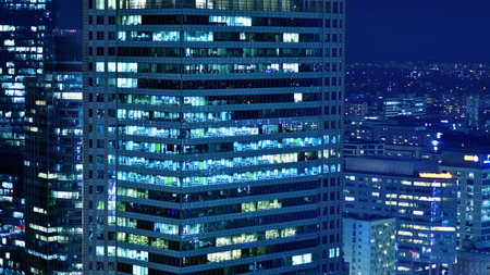 Aerial photography of modern architectural landscapes at night. Lights in the windows of buildings. The blue color of twilight.の写真素材