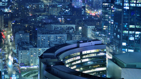 Aerial photography of modern architectural landscapes at night. Lights in the windows of buildings. The blue color of twilight.の写真素材