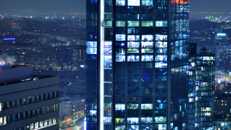 Aerial photography of modern architectural landscapes in the fog at night. Lights in the windows of buildings. The blue color of twilight.の写真素材