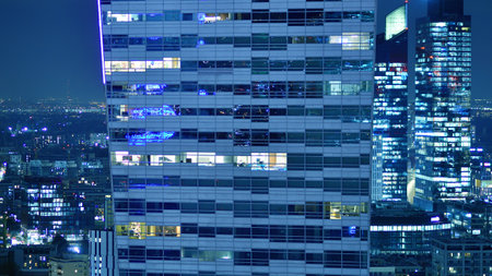Aerial photography of modern architectural landscapes at night. Lights in the windows of buildings. The blue color of twilight.の写真素材