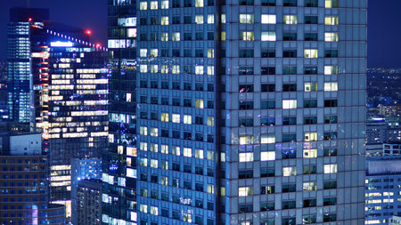 Aerial photography of modern architectural landscapes at night. Lights in the windows of buildings. The blue color of twilight.の写真素材
