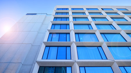 Large glass windows in a modern hotel building. Modern urban architecture. Large expansions of glass in concrete wall panels.の写真素材