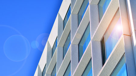 Large glass windows in a modern hotel building. Modern urban architecture. Large expansions of glass...
