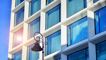 Large glass windows in a modern hotel building. Modern urban architecture. Large expansions of glass in concrete wall panels.の写真素材