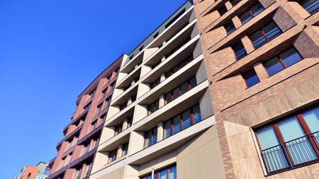 Modern apartment buildings on a sunny day with a blue sky. Facade of a modern apartment buildingの写真素材