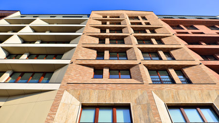 Modern apartment buildings on a sunny day with a blue sky. Facade of a modern apartment buildingの写真素材