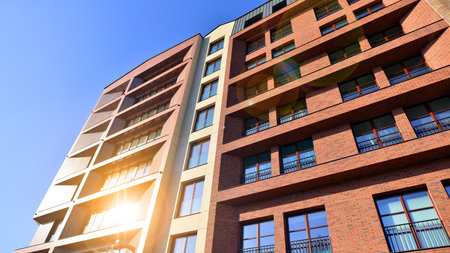 Modern apartment buildings on a sunny day with a blue sky. Facade of a modern apartment buildingの写真素材