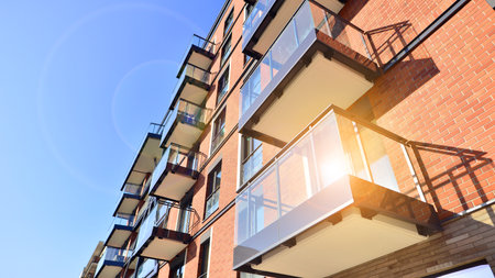 Modern apartment buildings on a sunny day with a blue sky. Facade of a modern apartment buildingの写真素材