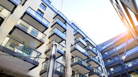 Modern apartment buildings on a sunny day with a blue sky. Facade of a modern apartment buildingの写真素材