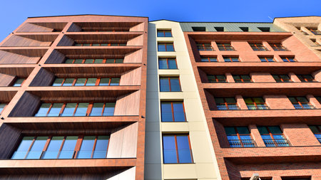 Modern apartment buildings on a sunny day with a blue sky. Facade of a modern apartment buildingの写真素材