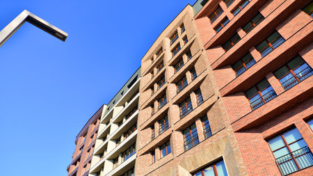 Modern apartment buildings on a sunny day with a blue sky. Facade of a modern apartment buildingの写真素材