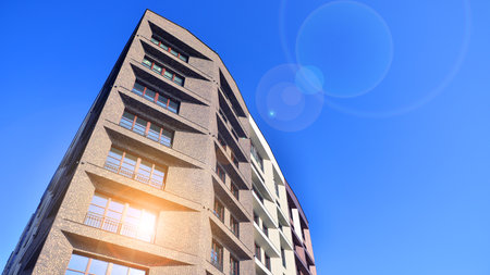 Modern apartment buildings on a sunny day with a blue sky. Facade of a modern apartment buildingの写真素材