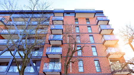 Modern apartment buildings on a sunny day with a blue sky. Facade of a modern apartment buildingの写真素材