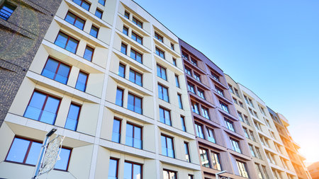 Modern apartment buildings on a sunny day with a blue sky. Facade of a modern apartment buildingの写真素材