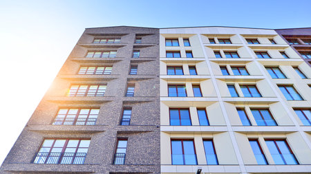 Modern apartment buildings on a sunny day with a blue sky. Facade of a modern apartment building