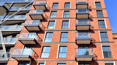 Modern apartment buildings on a sunny day with a blue sky. Facade of a modern apartment buildingの写真素材
