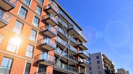 Modern apartment buildings on a sunny day with a blue sky. Facade of a modern apartment buildingの写真素材